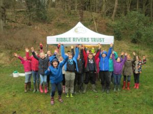 A group of school children getting involved in a Ribble Rivers Trust event. 
